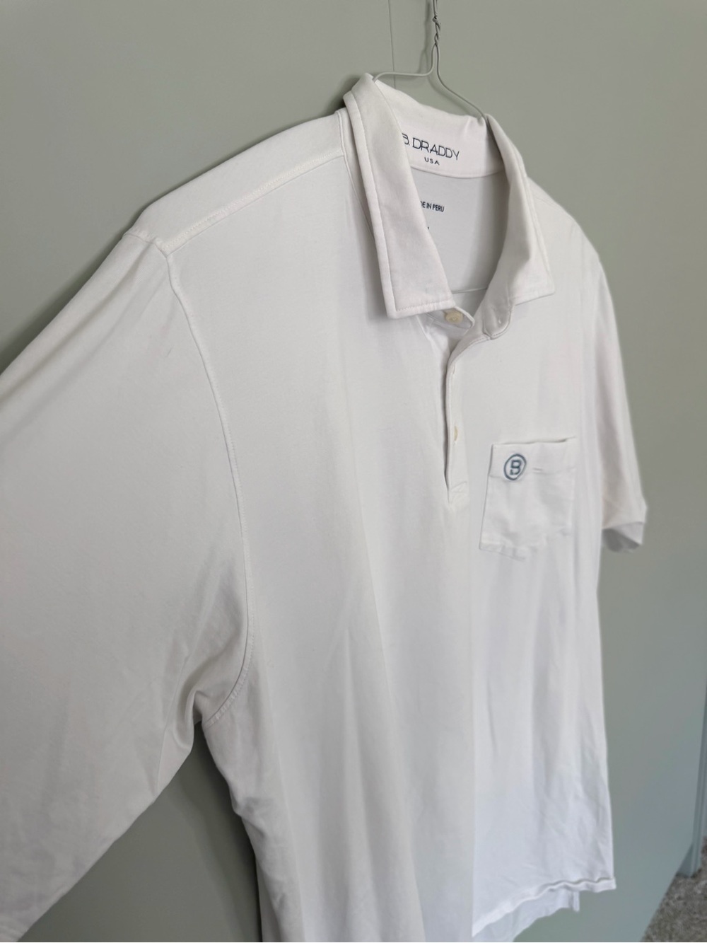 B.DRADDY Men’s Solid White Liam Polo with North Carolina flag and “B” Logo Patch - Picture 5 of 8